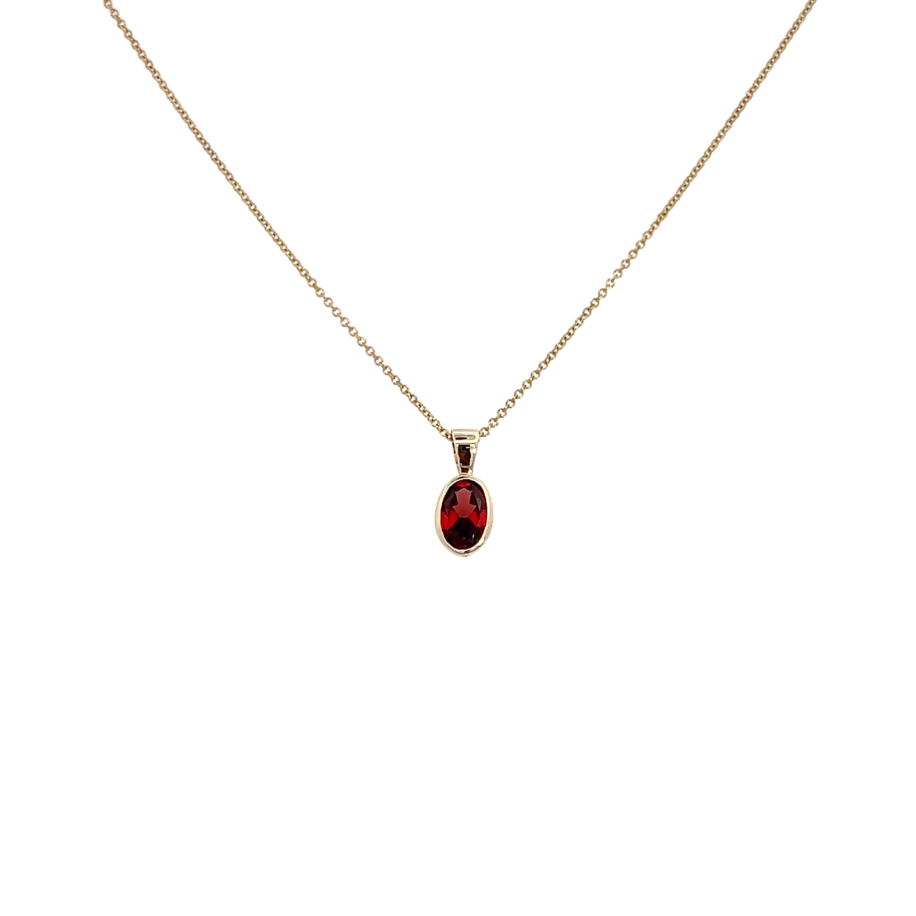 9 Carat Yellow Gold 5x7 Oval Garnet in a Rub Over Setting